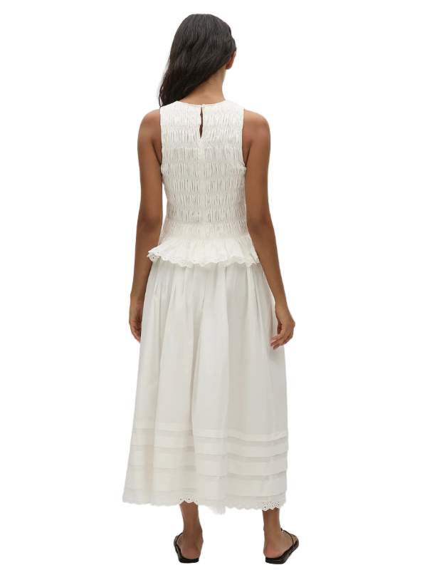 Ruth Skirt in White by FaithFull - side view showcasing the softly gathered A-line silhouette.