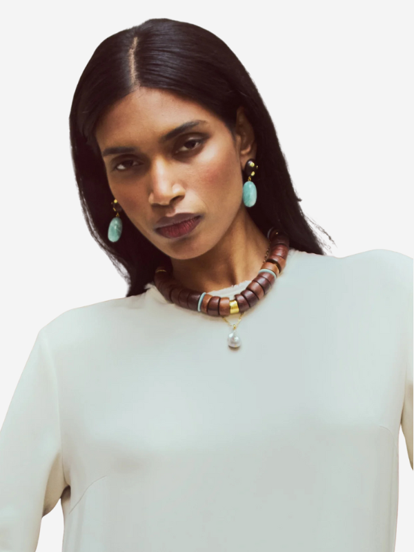 Close-up view of Nopales Earrings showcasing the intricate design and materials like acacia wood and gold-plated brass.