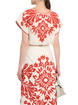Stylish Lilana Applique Top in Red with short sleeves and blouson fit, perfect for casual outings.