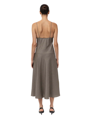Full-length look at the Asymmetric Slip Dress in Khaki Pinstripe, demonstrating the overall chic design and elegant draping. A must-have asymmetric slip dress for any wardrobe.