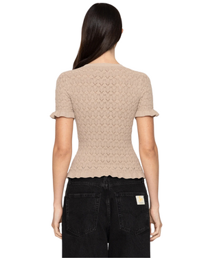 The back view of the Ruby Top in Champagne by SEA New York, highlighting the intricate details and shimmering fabric.