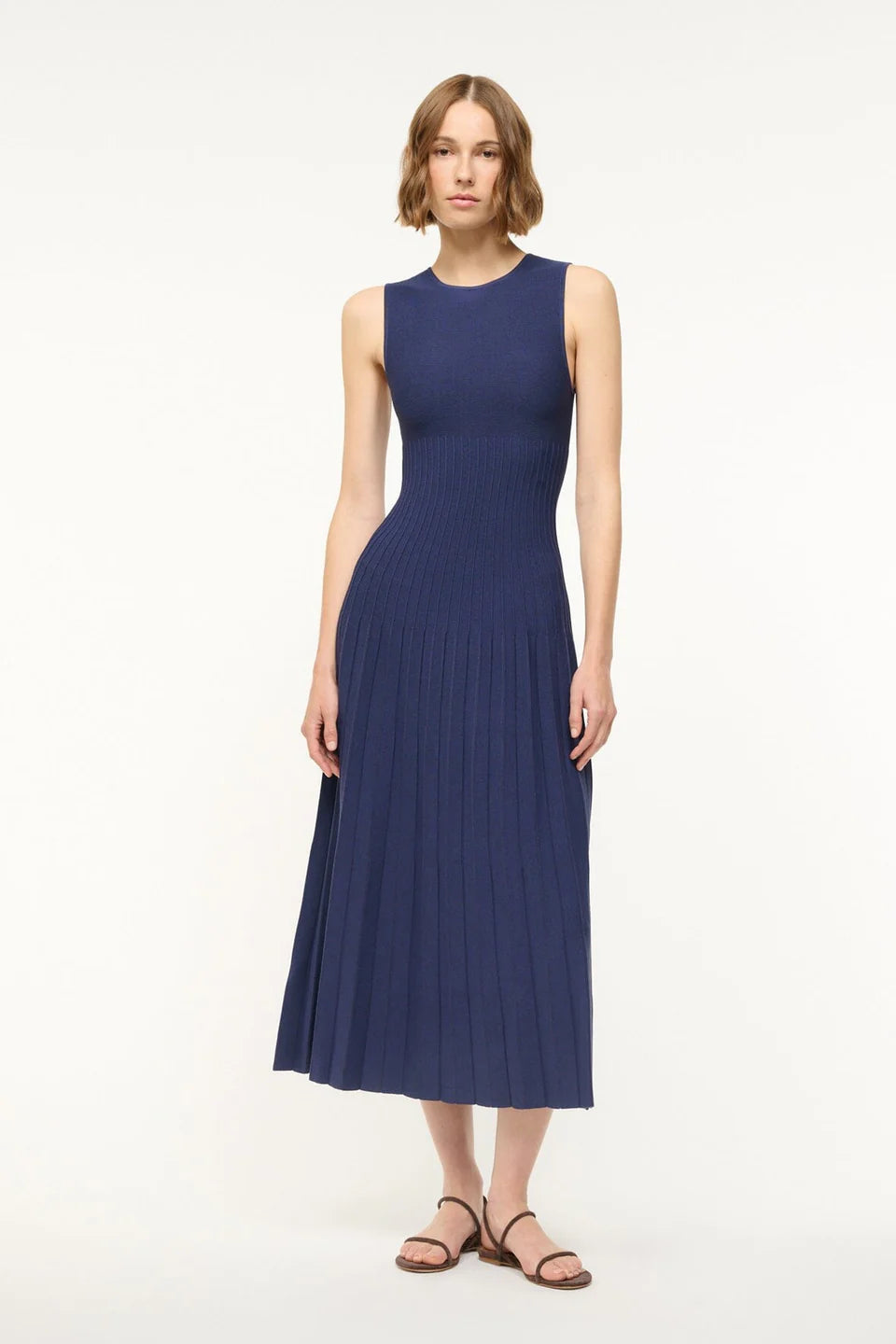 Back view of the Elyse Dress in Navy, emphasizing the sleek silhouette and modern design by Staud.