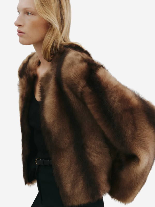 Model wearing the Elan Shearling Jacket in Camel/Brown, illustrating its elegant and cozy look.