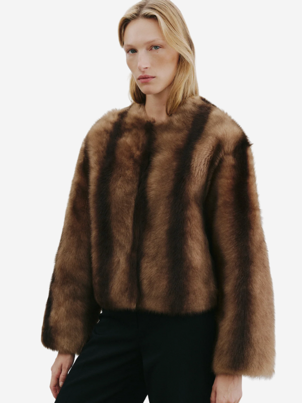 Close-up view of the luxurious Elan Shearling Jacket in Camel/Brown, made from 100% lambskin leather.