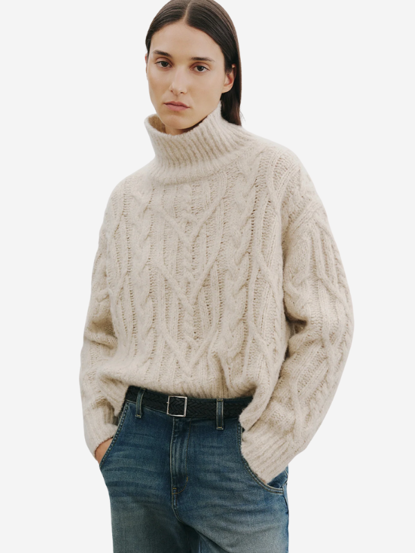 Model wearing the Nili Lotan Fairiny Sweater in Beige Melange featuring an oversized boxy fit and drop shoulder sleeves.