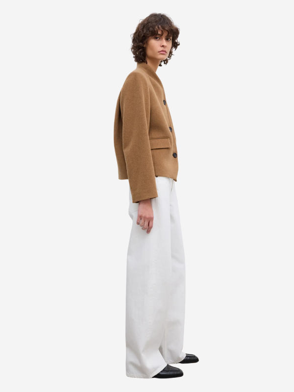 Close-up of the Short Curved Jacket in Camel, highlighting the Italian wool fabric and curved front closure.