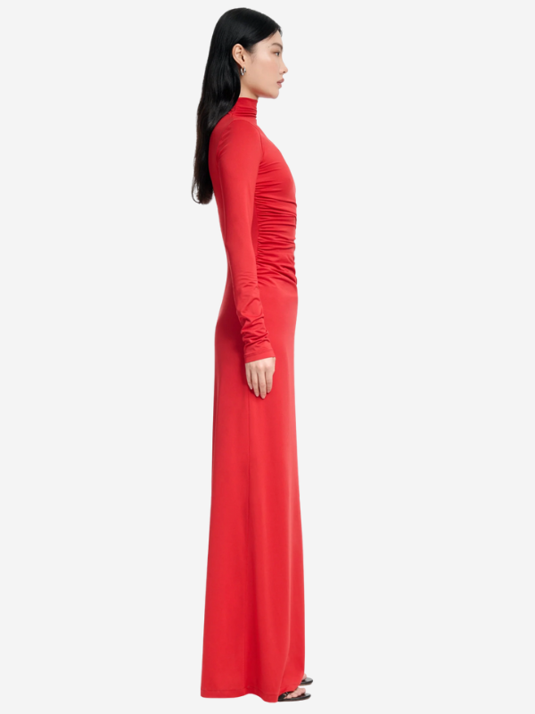 Model wearing the Jazmina Dress in Grenadine, perfect for evening wear with long sleeves and stylish silhouette.