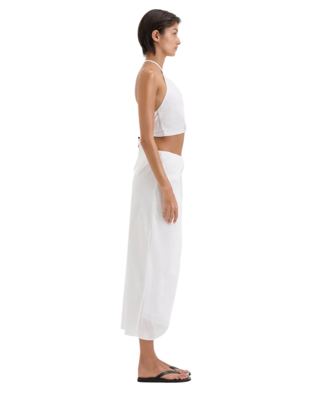 Model wearing the Azura Tie Top in Ivory, an on-trend ivory tie top with gathered detailing.
