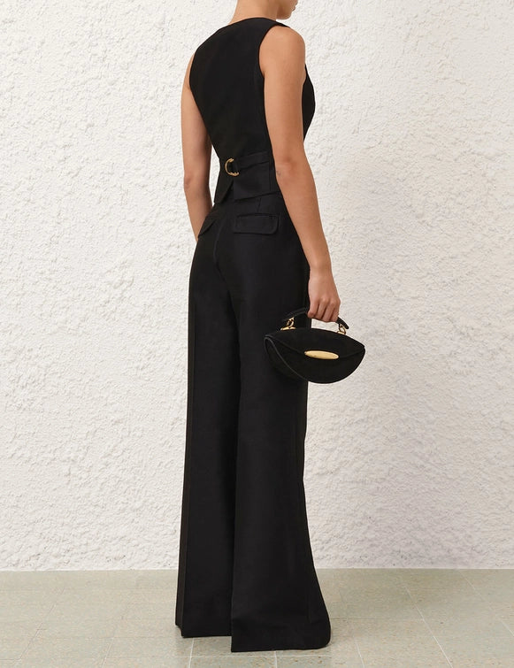 Model wearing the Hypnotic Flare Pant in Black, styled for a chic and trendy look, perfect for the fall season.