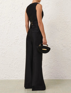 Model wearing the Hypnotic Flare Pant in Black, styled for a chic and trendy look, perfect for the fall season.