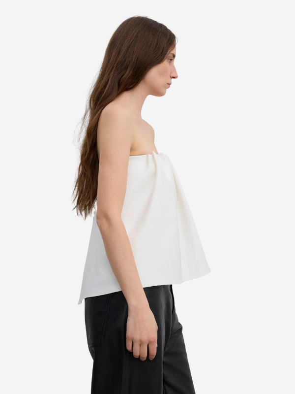 Model wearing the Rouched Tube Top in White by House of Dagmar, perfect for any summer occasion.