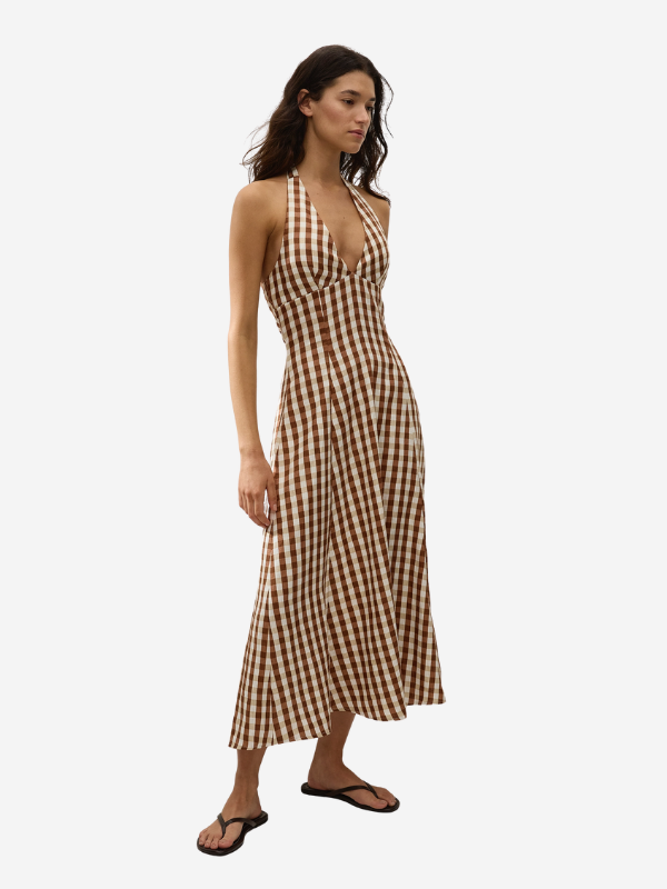 Back view of the Marais Midi Dress in Gingham Cedar by Faithfull, highlighting the shirred waist design for a comfortable fit.