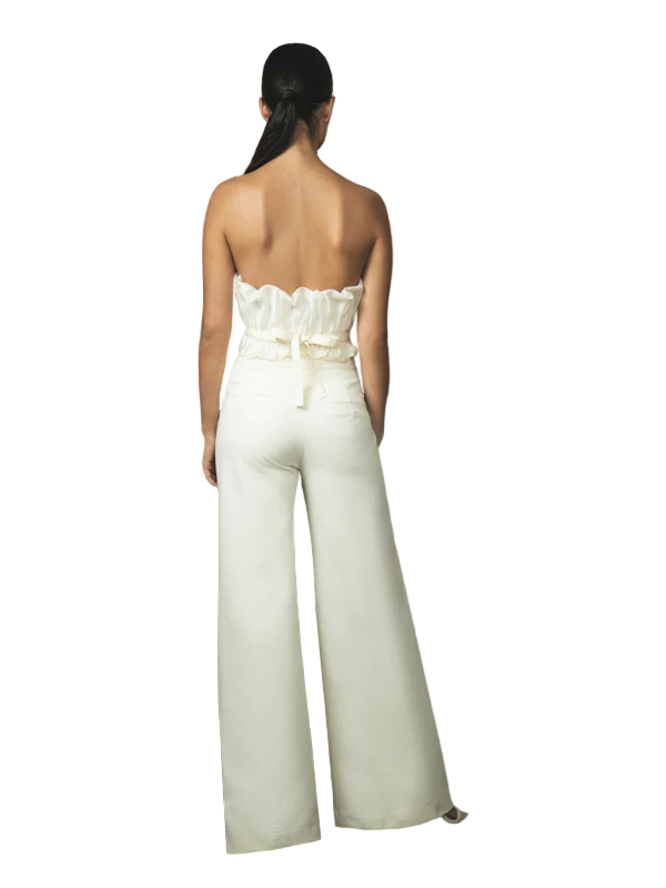 Model wearing the Auroras in Off White top by Andres Otalora, featuring a unique design perfect for elegant occasions.