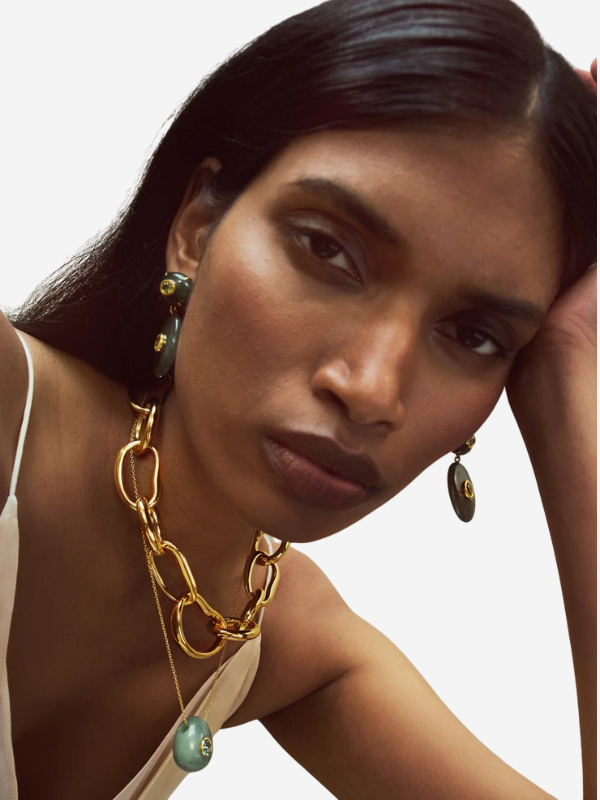 Elegant display of the Constance Necklace in Green Aventurine, highlighting its 18-inch gold-plated brass chain and the intricate design with a unique green aventurine egg pendant.