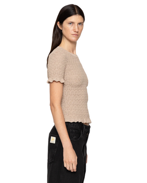 Flat lay of the Ruby Top in Champagne, crafted from 83% Viscose and 17% Elite, perfect for chic casual looks.