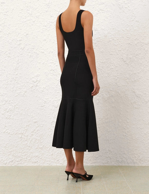 Back view of the Hypnotic Sculptural Midi Dress in Black emphasizing its stylish design.