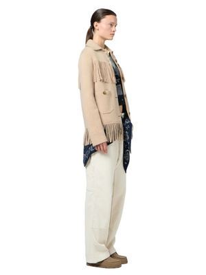 Model wearing the Western Fringe Jacket in Dune styled with a casual outfit against a neutral background.