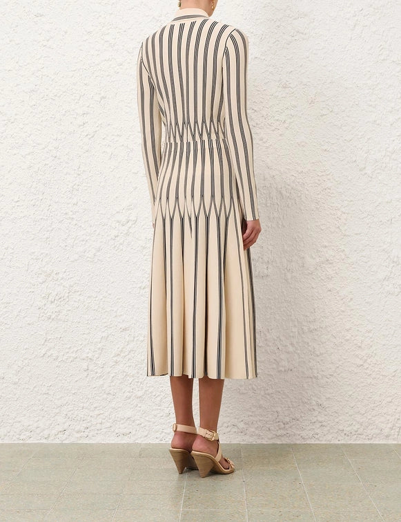 Back view of the Rebellion Striped Midi Skirt in Cream Stripe highlighting the pleats and chic style from Zimmermann.