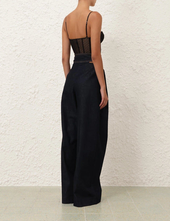 Model wearing the Dot Bodysuit in Black, showcasing its form-fitting design and stylish look.