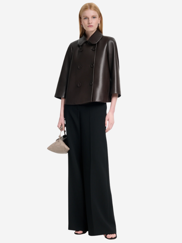 The Hayden Jacket in Tobacco by Altuzarra styled with tailored leggings and heels, highlighting its loose-fitting silhouette.