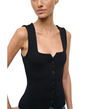 Model wearing the Marisa Top in Black, showcasing its elegant silhouette and comfortable fit.