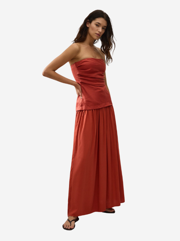 Close-up of the Hedy Maxi Dress in Dusty Tomato, featuring the textured linen fabric and unique gathering.