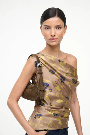 Owen Bag in Truffle on a stylish background, demonstrating its design elegance.
