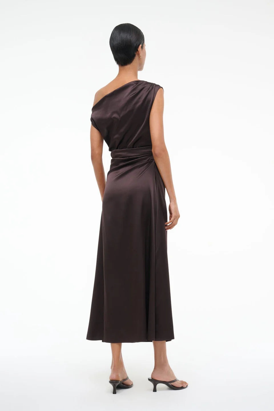 Model wearing Staud Phare Dress in Earth, emphasizing the elegant off-the-shoulder silhouette.