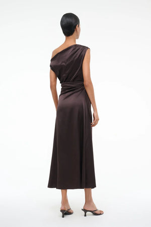 Model wearing Staud Phare Dress in Earth, emphasizing the elegant off-the-shoulder silhouette.