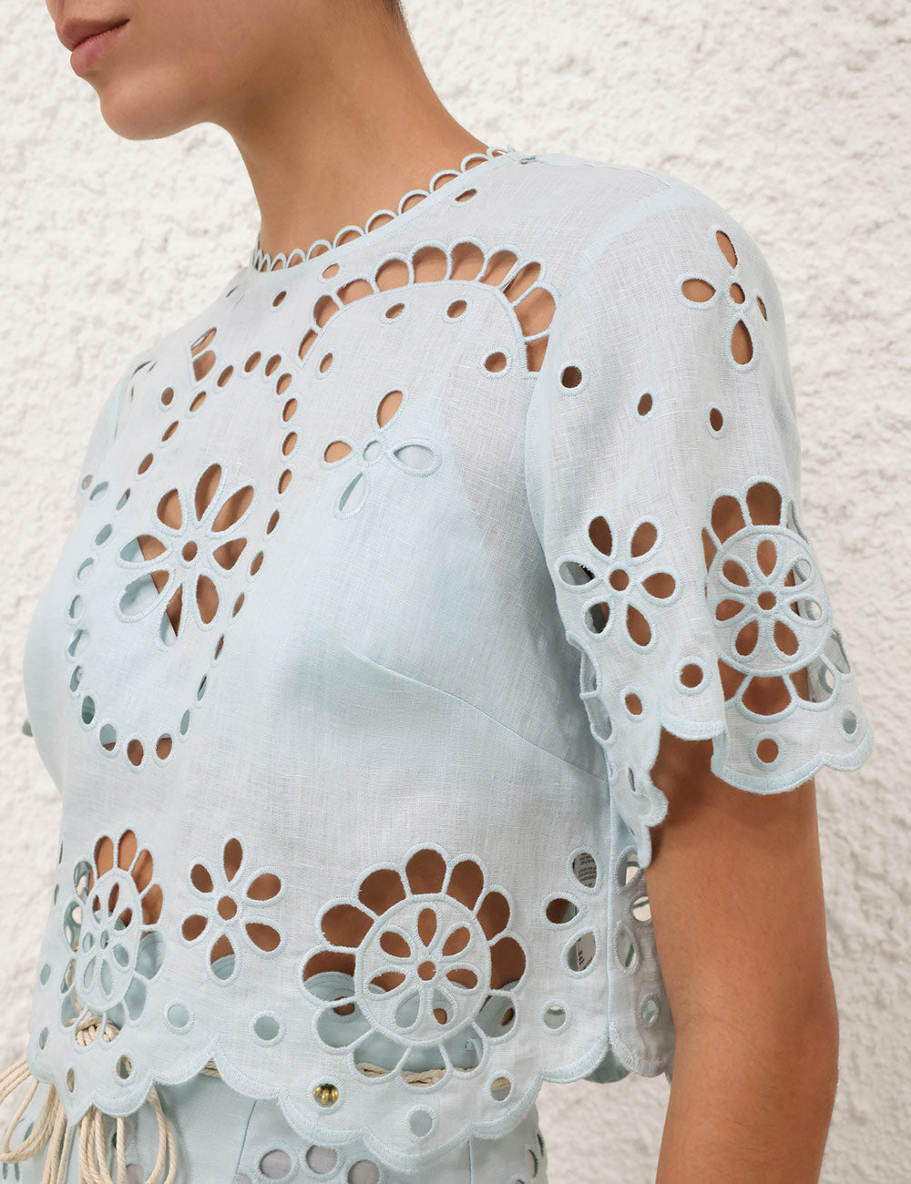 Detail of the scalloped trim on the sleeves and hem of the Awaken Embroidered Bodice in Mint.