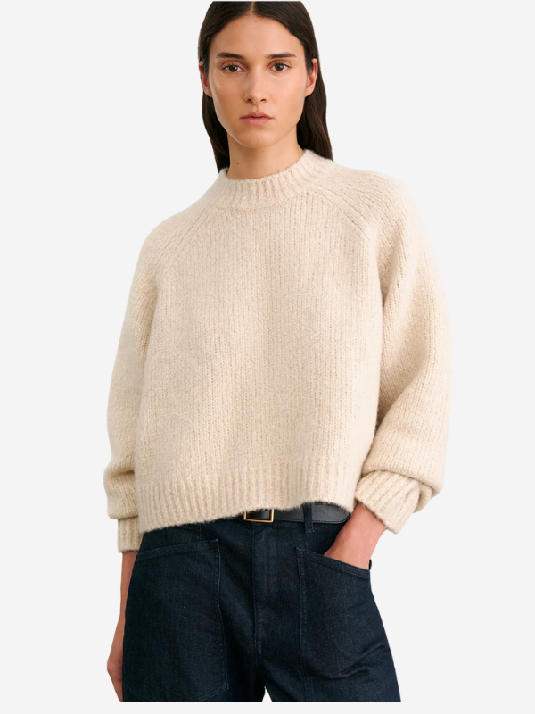 Back view of the Tomaso Sweater in Ivory by Nili Lotan, displaying the signature center back cable knit detail.