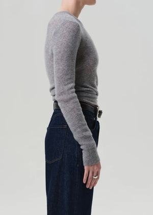 Model wearing the Alessia Crewneck in Dark Heather Grey styled with denim for a chic outfit.