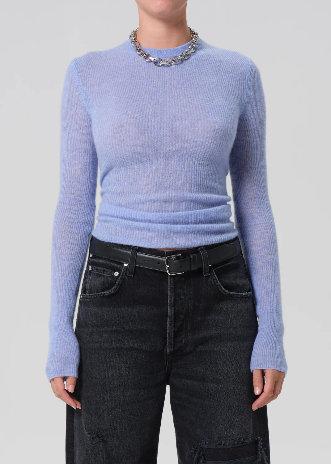 Model wearing Alessia Crewneck Sweater in Heather Robin, styled over a crisp shirt for a chic layered look.