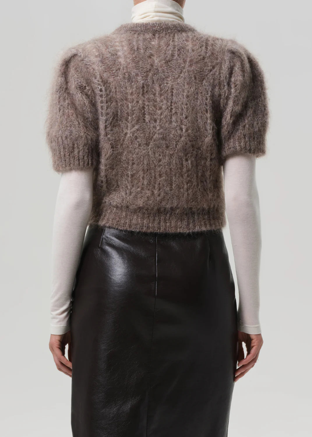 Odette Puff Sleeve Sweater in Mushroom displayed on a hanger, emphasizing its elegant color and design.