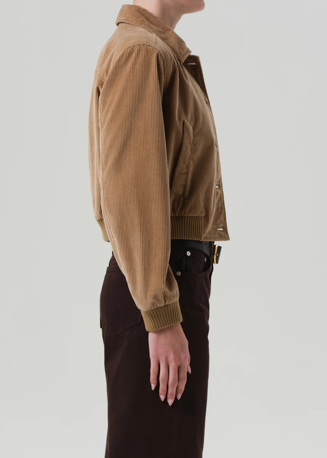 Lola Eve Bomber in Amber worn over a crisp shirt, perfect for a stylish layered look.