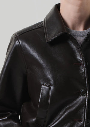 Lola Leather Bomber in Brown laid flat, emphasizing the rich, deep color and quality of recycled leather by Citizens of Humanity.
