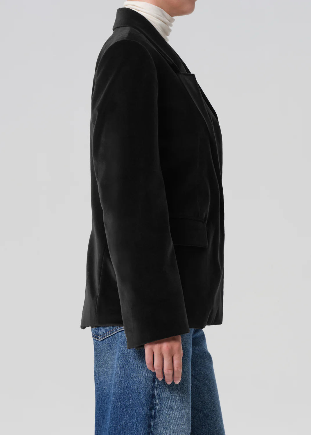 Back view of the Matteau Velvet Blazer in Black showing its classic single-breasted silhouette.