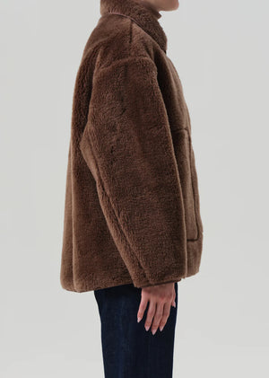 Astrid Sherpa Jacket in Warm Tan styled with casual wear, perfect for a relaxed outfit.