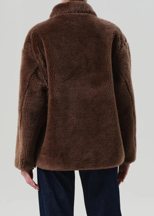 Back view of the Astrid Sherpa Jacket in Warm Tan, showcasing its relaxed silhouette.