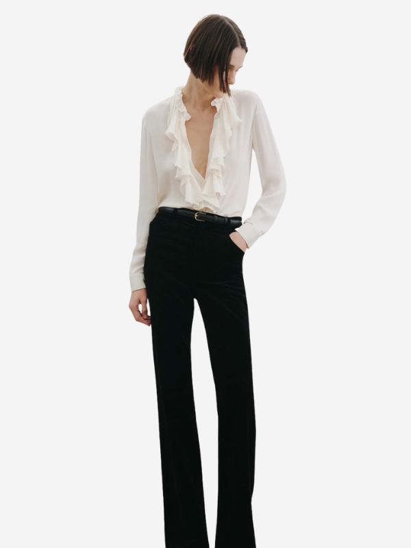 The cascading ruffle detail at the bib of the Lily Blouse in Ivory from Nili Lotan.