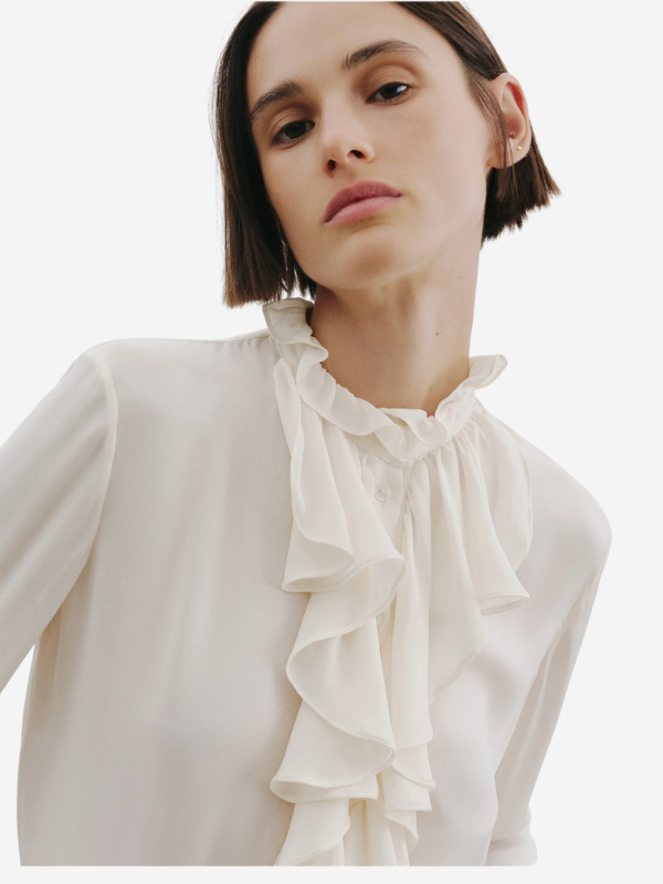 The straight hem design of the Lily Blouse in Ivory by Nili Lotan.