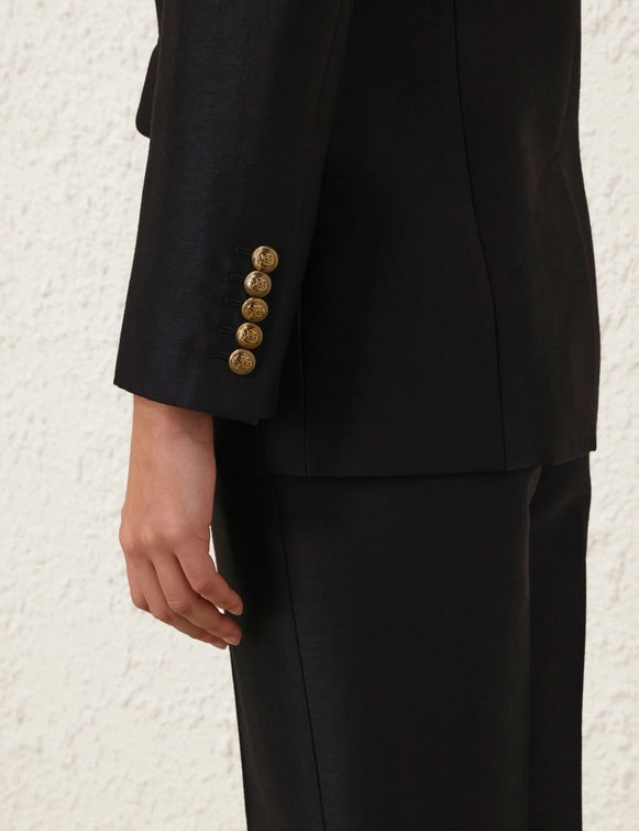 Detail shot of the Hypnotic Tailored Jacket in Black, focusing on the peak lapels and high-quality fabric from Zimmermann.