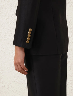Detail shot of the Hypnotic Tailored Jacket in Black, focusing on the peak lapels and high-quality fabric from Zimmermann.