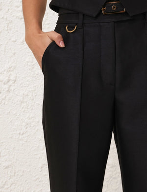 Front view close-up of Hypnotic Flare Pant in Black showing the detailed pintucks and elegant silhouette.