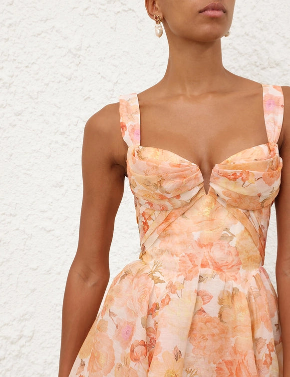 Close-up of the fabric texture of the Rebellion Drape Midi Dress in Golden Bloom, showcasing its premium quality.