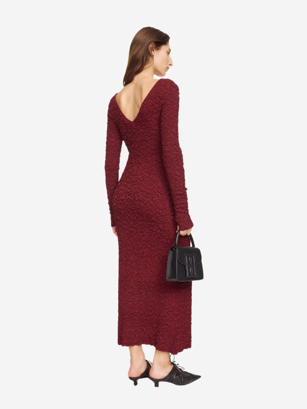 Stylish flat lay of the Venus Dress in Cabernet by By Malene Birger, perfect for pairing with flats or kitten heels.