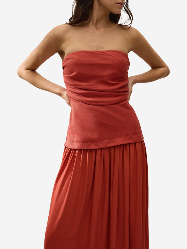 Back view of the Hedy Maxi Dress in Dusty Tomato, showing off the flattering silhouette and waistline.