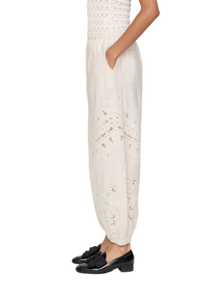 Full view of Shanna Lace Track Pants in Cream styled for a casual yet elegant outfit.