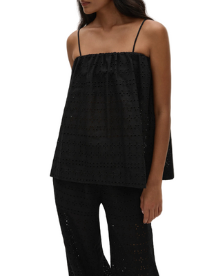 Back view of the Navia Top Agnes Broderie Anglaise in Black by FaithFull, showing the fit and style of the flowing overlay piece.