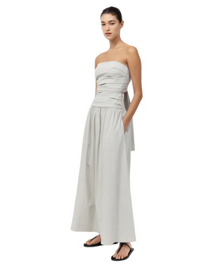 Back view of the Gathered Strapless Tie Back Dress in Silver with striking tie detail, highlighting its elegant form and style. A must-have strapless tie back dress.
